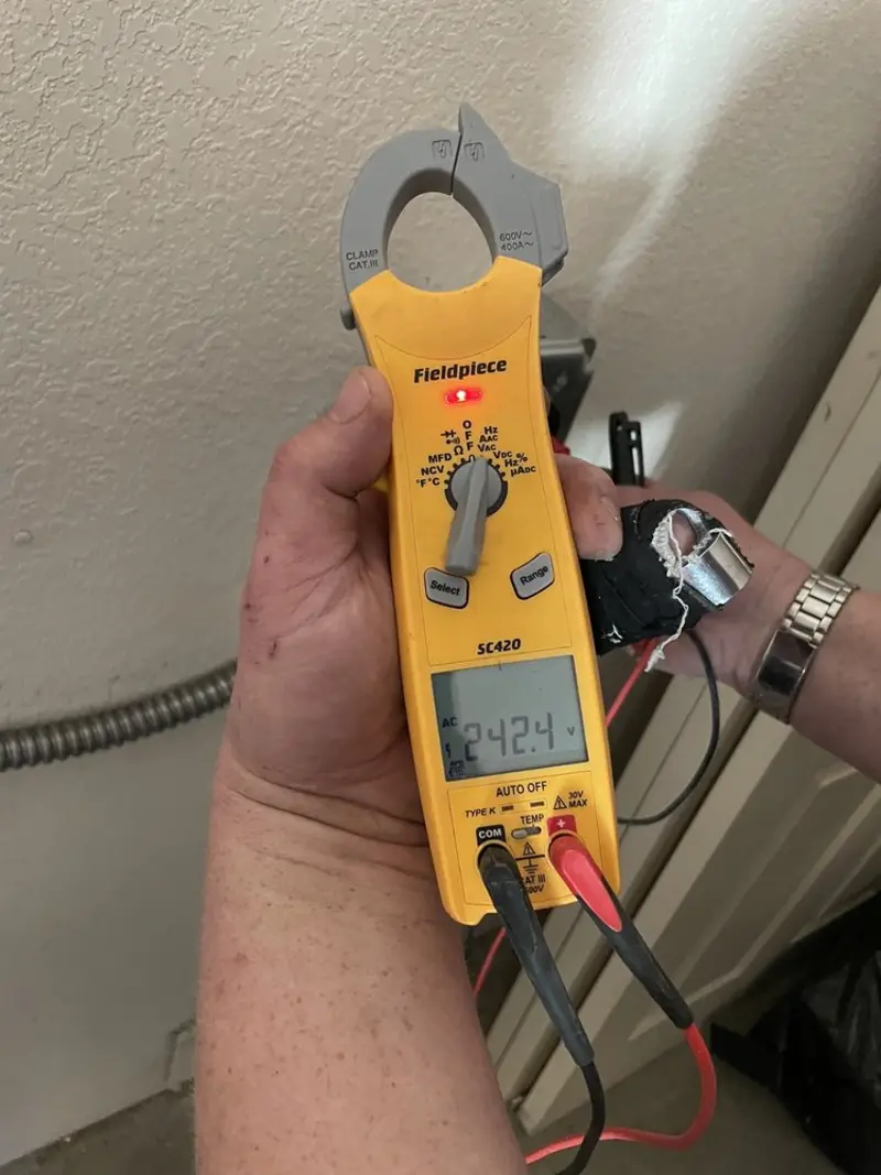 Voltage testing with clamp meter during Ceiling Fan Installation in Gateway
